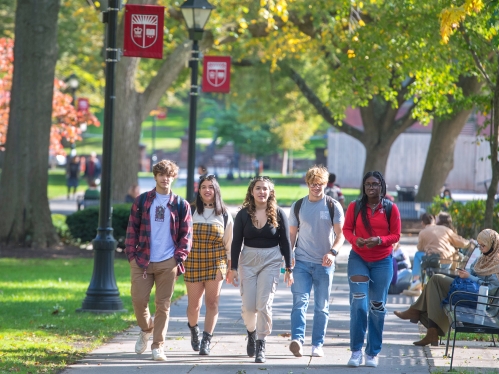 Students walking on Voorhees Mall on the College Ave campus